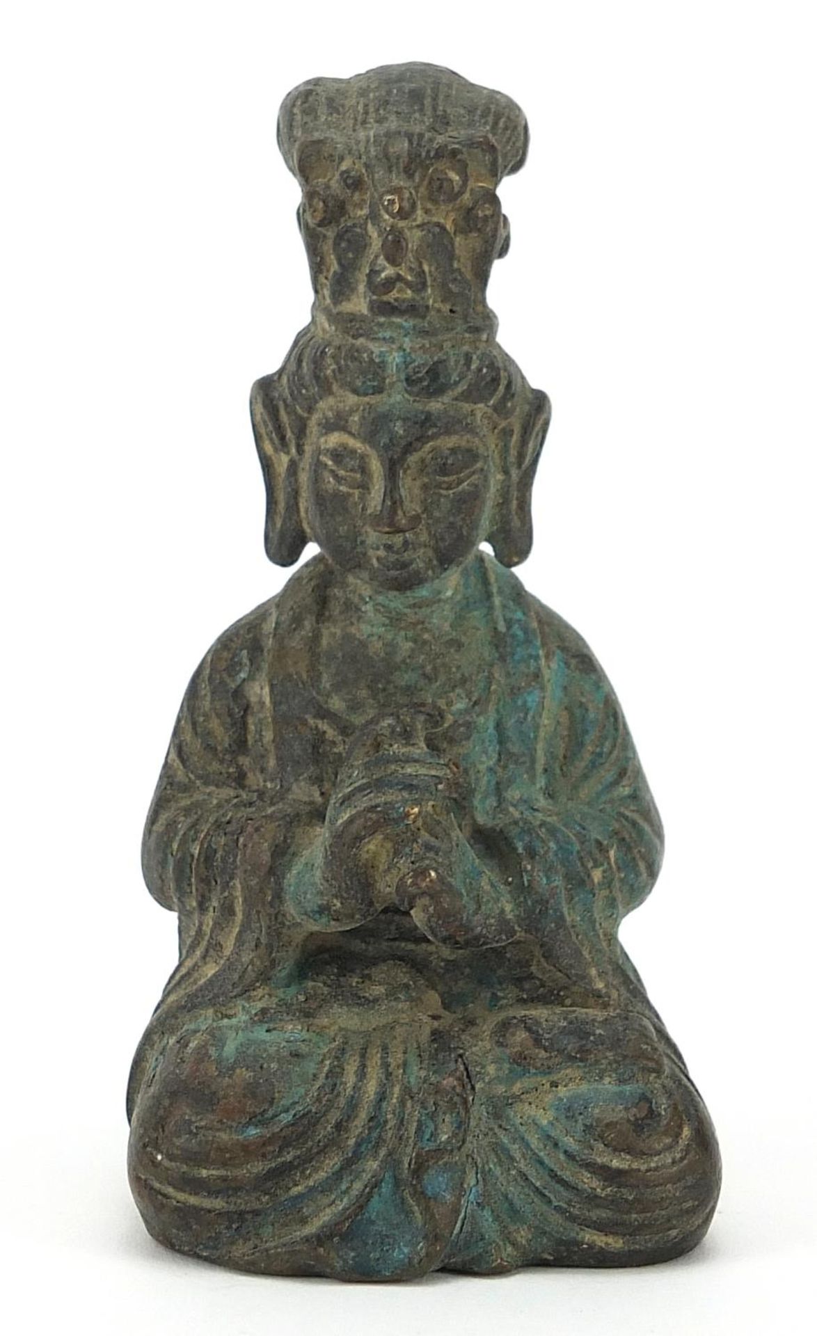 Chinese patinated bronze figure of a seated deity, 9cm high