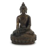 Chino Tibetan patinated bronze figure of a deity, 20cm high