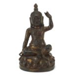 Chino Tibetan patinated bronze figure of seated Buddha, 23cm high