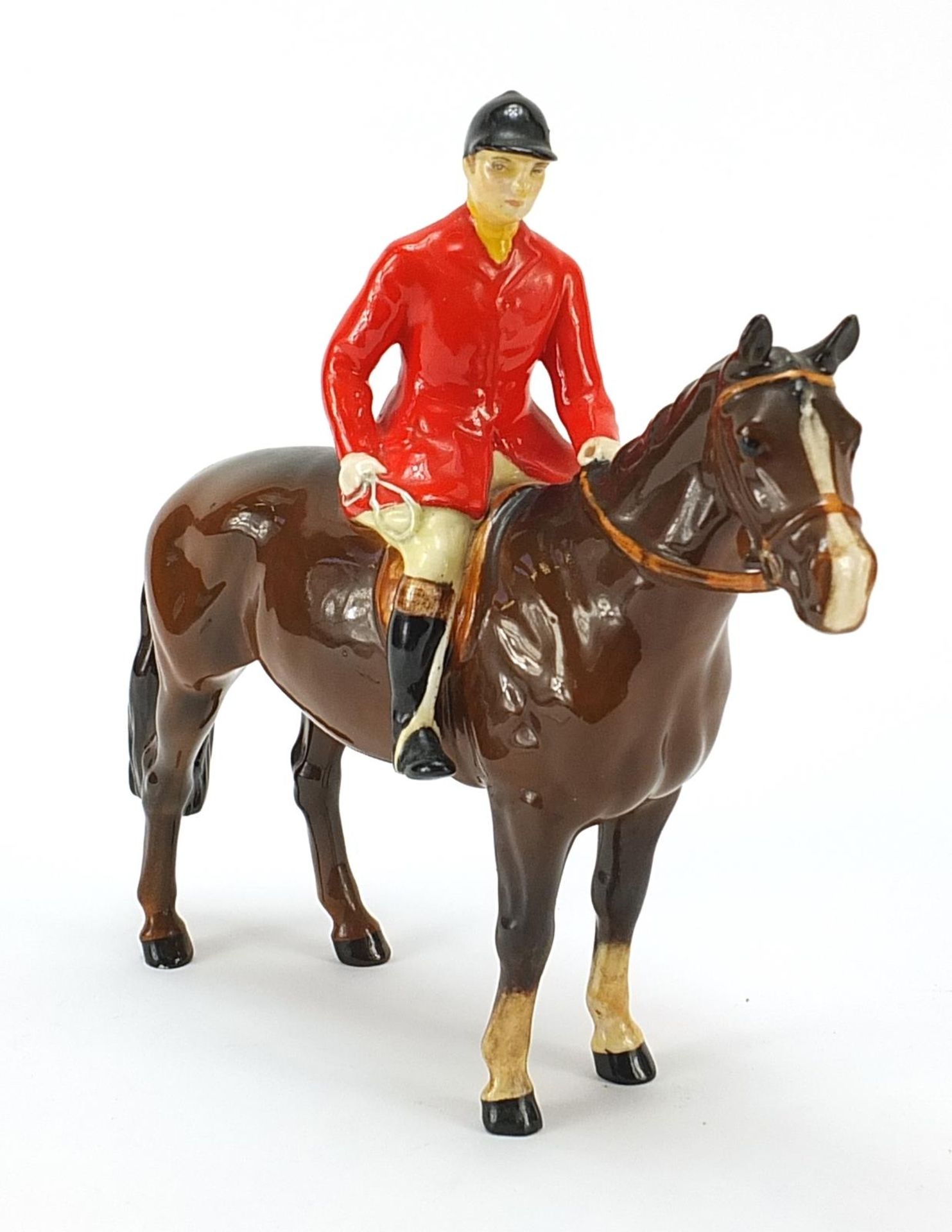 Beswick huntsman on horseback, 22cm in length
