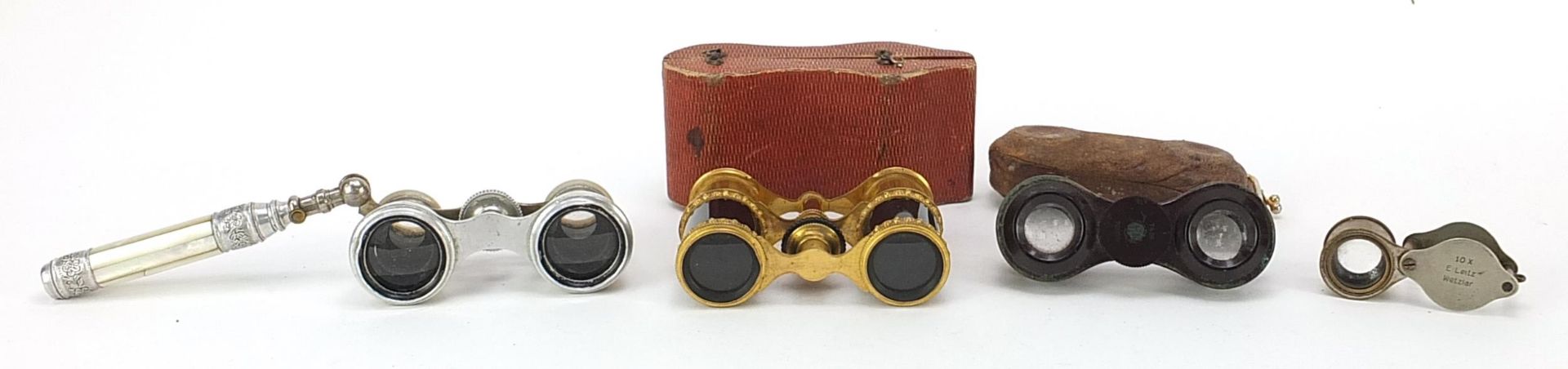 Three pairs of 19th century and later opera glasses and an Ernest Leitz x 10 magnifying loupe, the