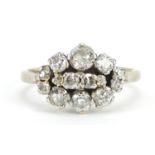 18ct white gold and platinum diamond cluster ring, the largest diamond approximately 0.34ct, size M,