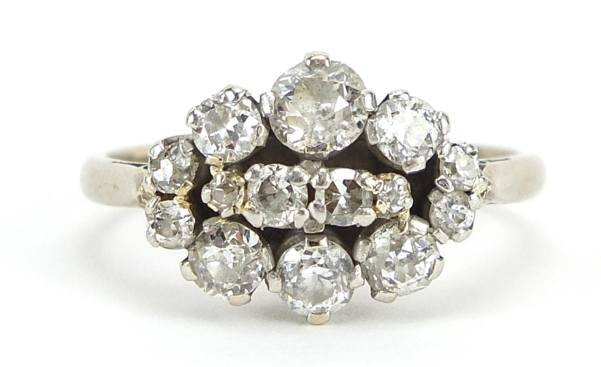 18ct white gold and platinum diamond cluster ring, the largest diamond approximately 0.34ct, size M,