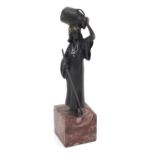 Cold painted bronze figure of a female water carrier raised on a square marble base, 19cm high