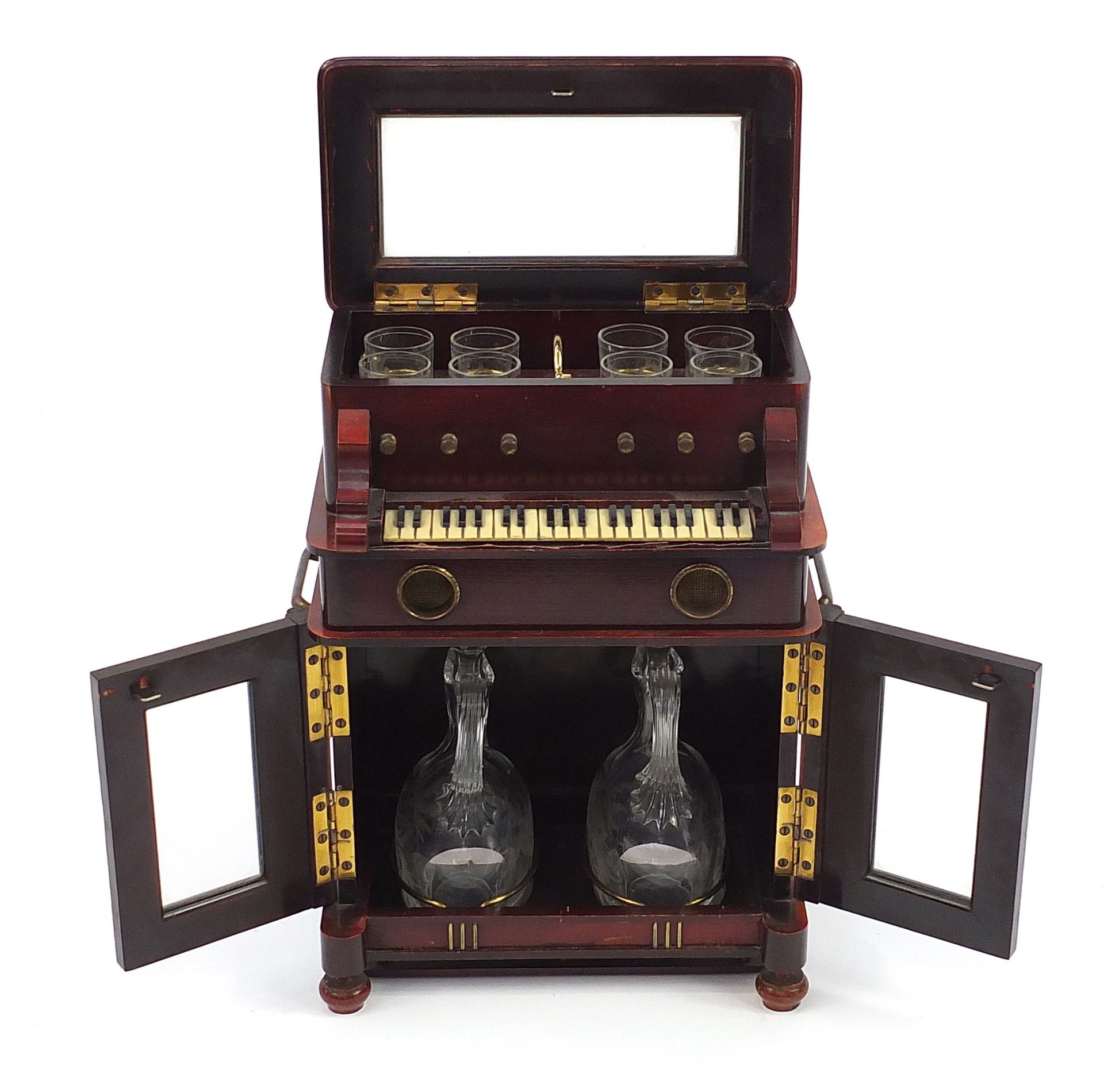 Novelty 19th century hardwood musical liqueur cabinet in the form of a piano with lift up top and
