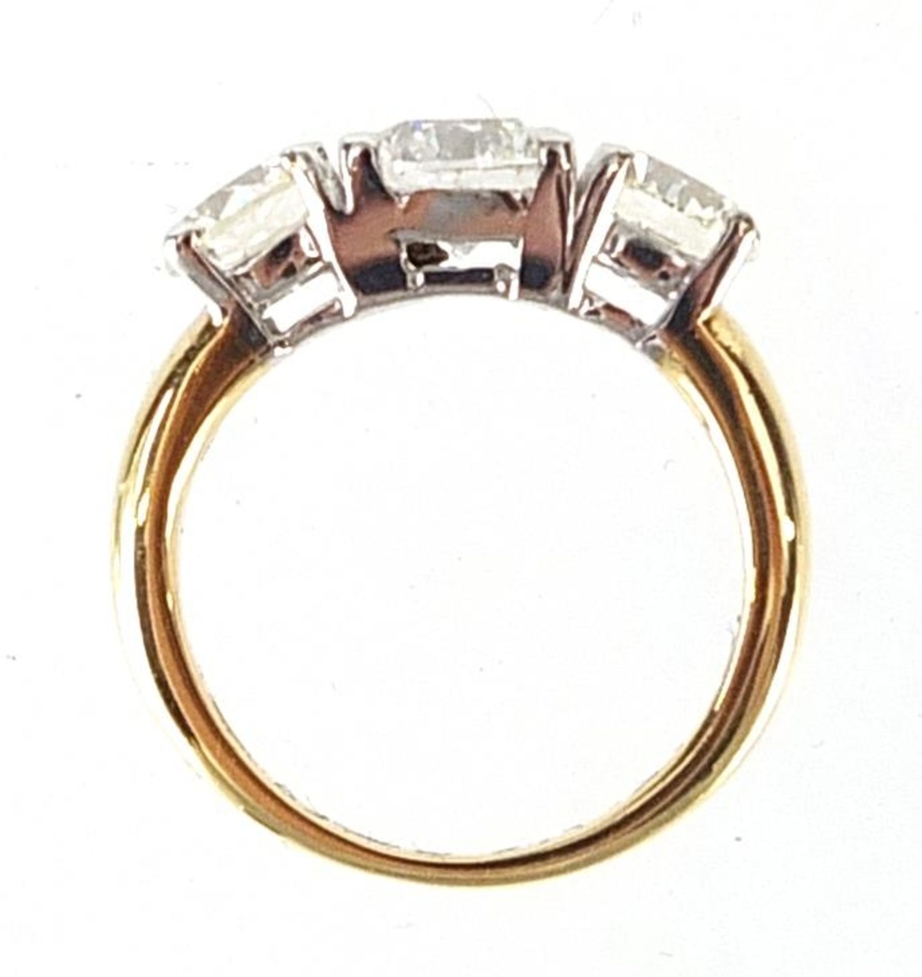 18ct gold diamond three stone ring, the central diamond weighing 0.96ct flanked by two diamonds each - Bild 5 aus 9