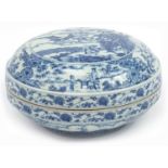Chinese blue and white porcelain box and cover hand painted with two figures before pagodas in a