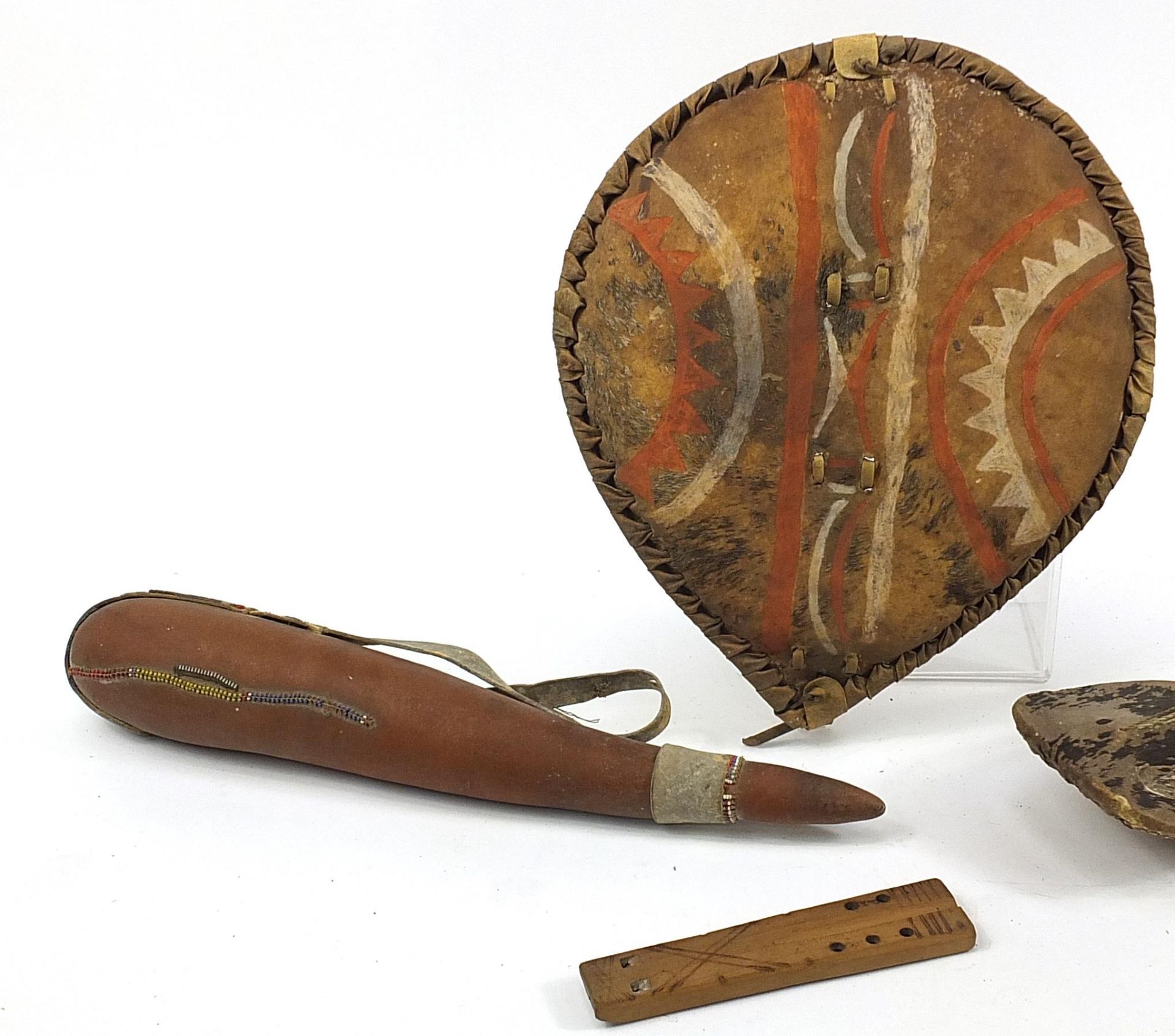 Tribal objects including a hand painted animal hide shield and musical instruments, the largest 50cm - Image 2 of 4