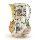 Turkish Kutahya pottery water jug hand painted with figures and flowers, 17cm high