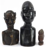 Three tribal interest carved hardwood busts, the largest 40cm high