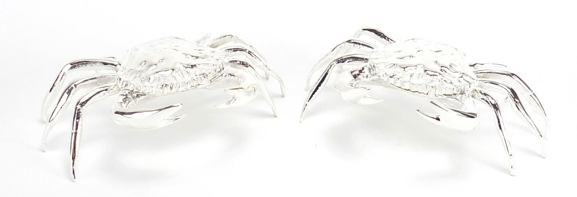 Pair of silver plated crab design trinkets with hinged lids, 12cm wide
