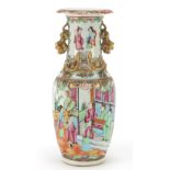 Chinese Canton porcelain vase with twin handles hand painted in the famille rose palette with