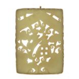 Chinese green jade panel carved with fruit housed in a white metal pendant mount, 8.5cm x 6cm