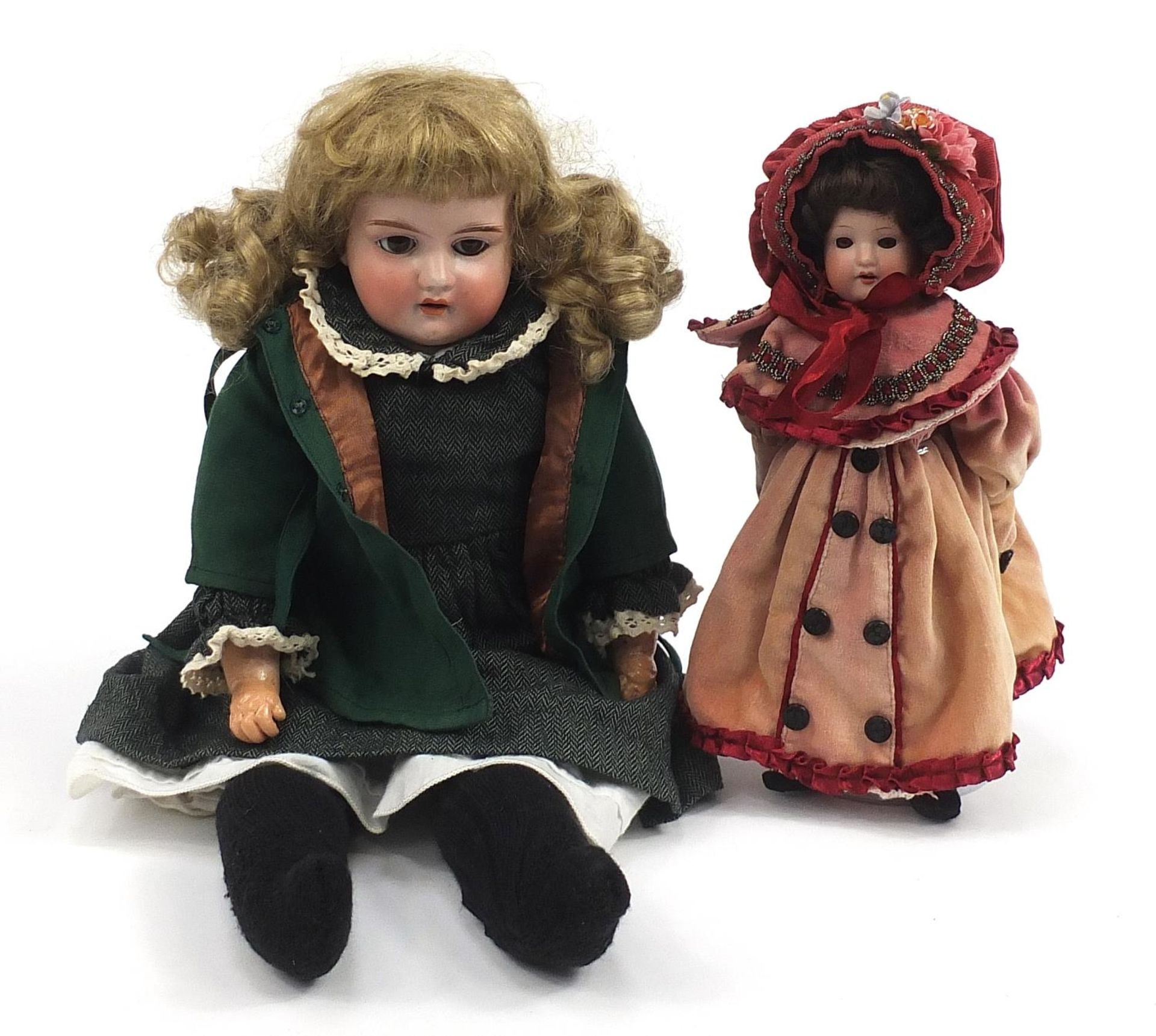 Two Armand Marseille German bisque headed dolls numbered 370 and 390, the largest 50cm high