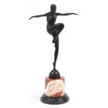 Large patinated bronze figurine of an Art Deco dancer raised on a marble and black slate base,