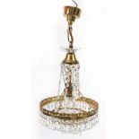 Gilt brass three tier chandelier with cut glass drops, 40cm high excluding fitting