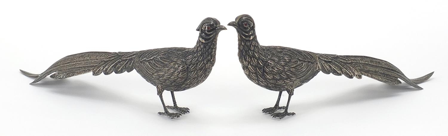 Pair of unmarked silver pheasants, 27cm in length, 154.0g