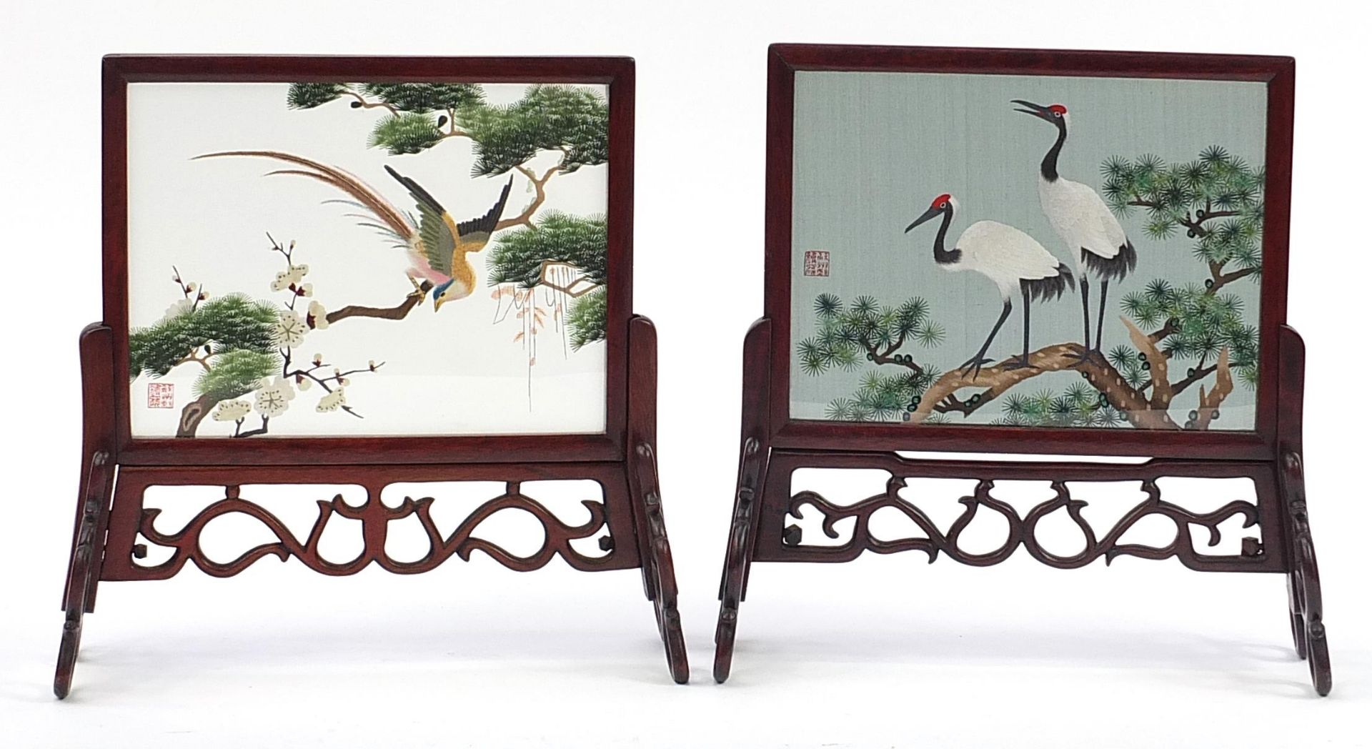 Pair of Chinese hardwood table screens with silk panels finely embroidered with birds of paradise