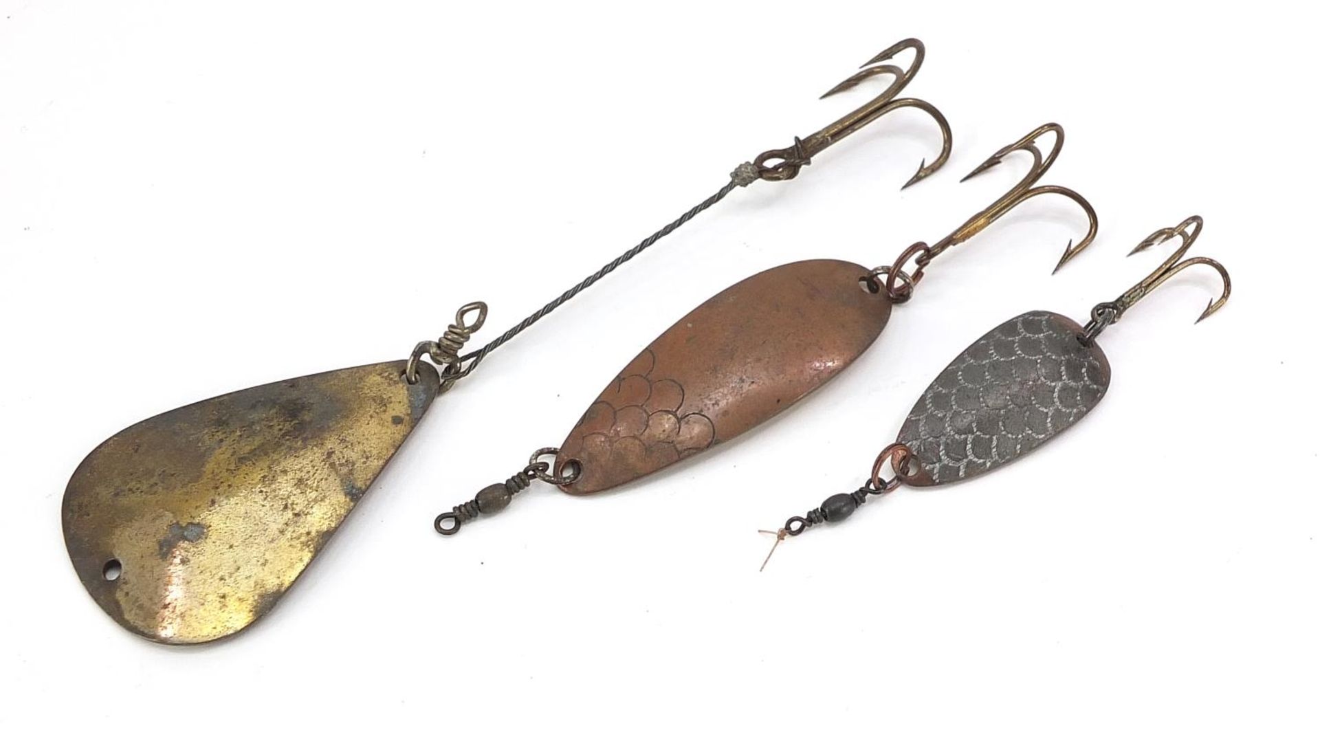 Three vintage Hardy Bros metal fishing lures/spoons, the largest 12.5cm in length