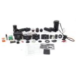 Three vintage Zenit cameras with a collection of lenses and accessories including Helios 135mm,