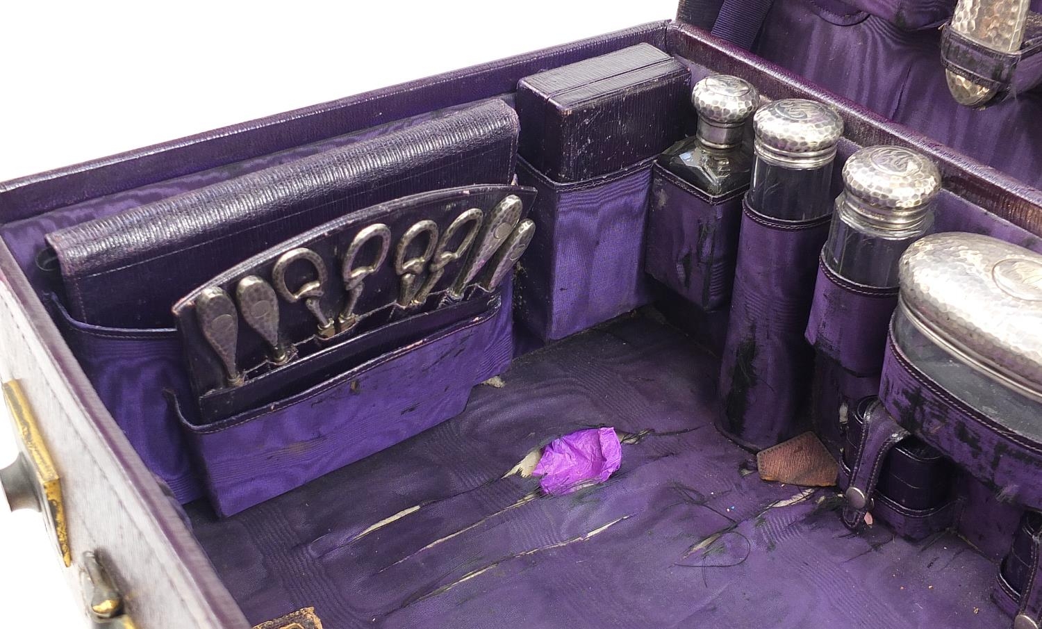 Edwardian purple leather travelling vanity case with silver mounted items including brushes, - Image 3 of 8