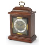 Walnut cased Elliott mantle clock retailed by Garrard of London with silvered chapter ring having