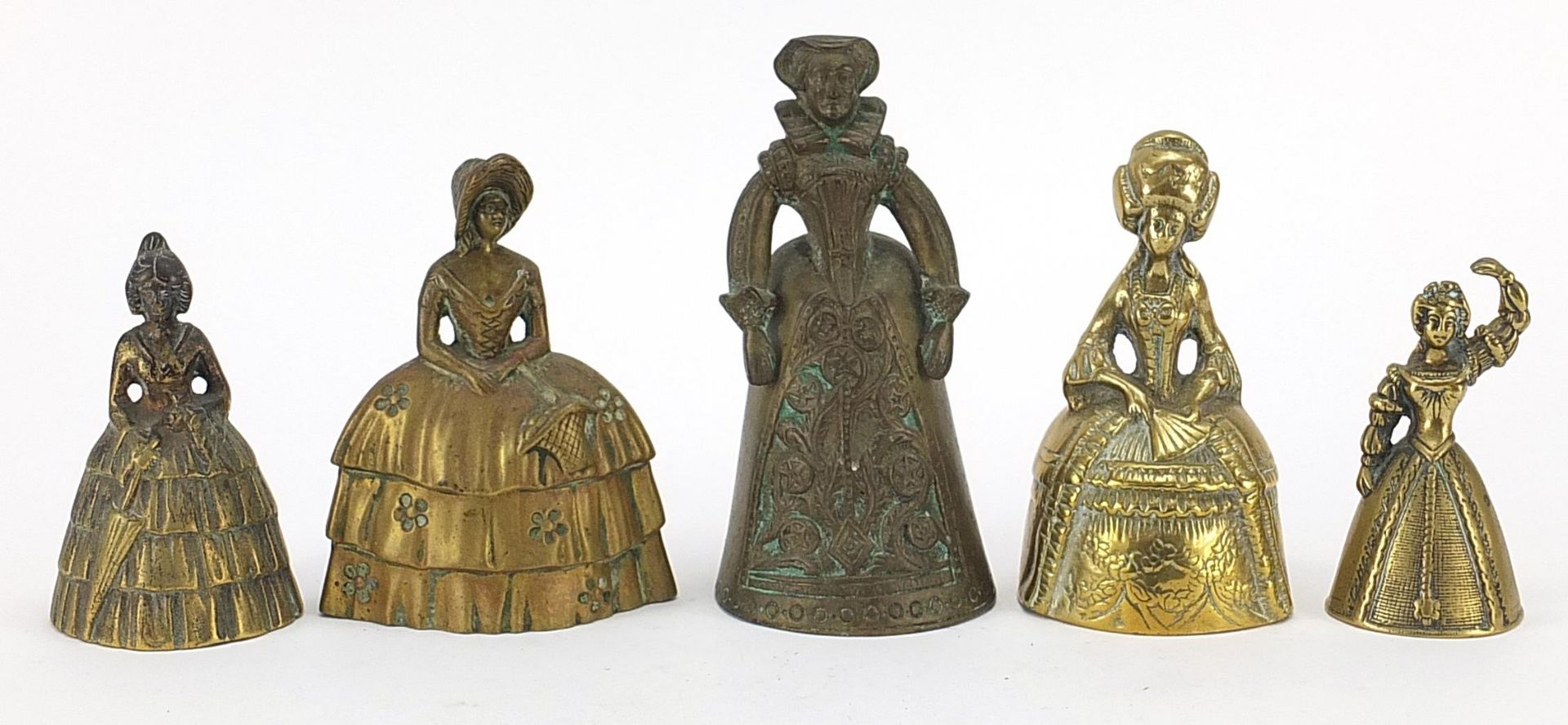 Five 19th century and later brass table bells in the form of females including one wearing Tudor