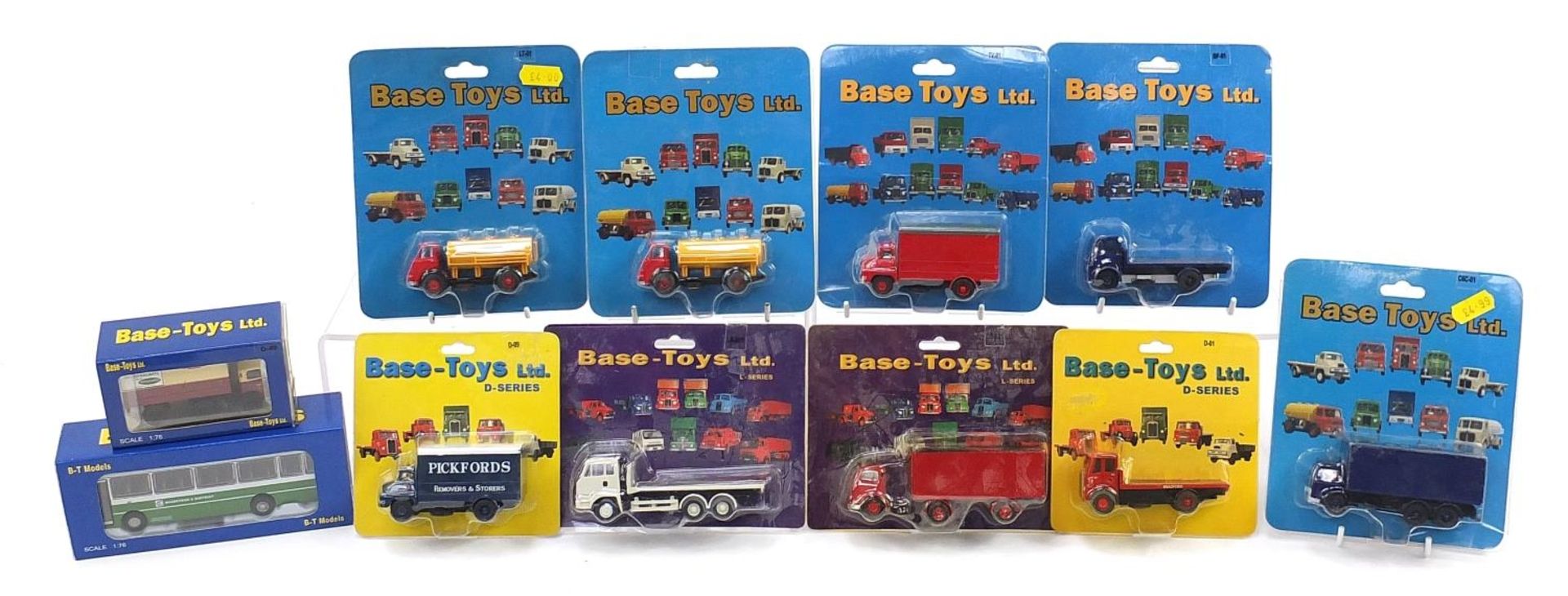 Collection of Base Toys diecast advertising vehicles with blister packs and boxes