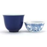 Two Chinese porcelain bowls including one having a blue glaze, character marks to the bases, the