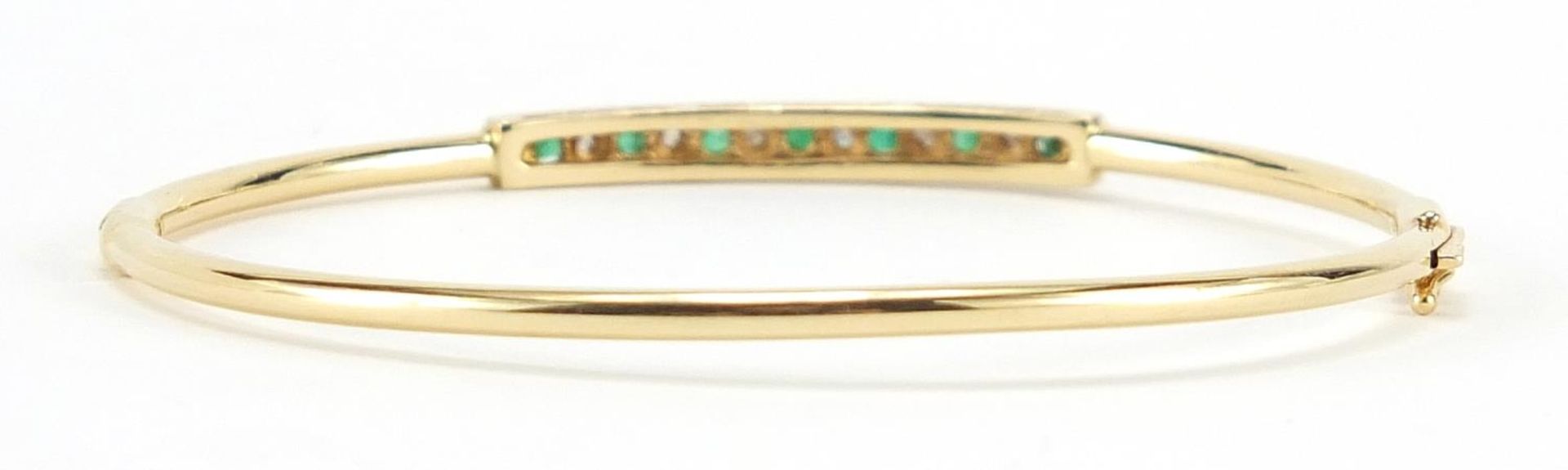 14ct gold emerald and diamond bangle, 6.3cm in diameter, 5.5g - Image 2 of 3