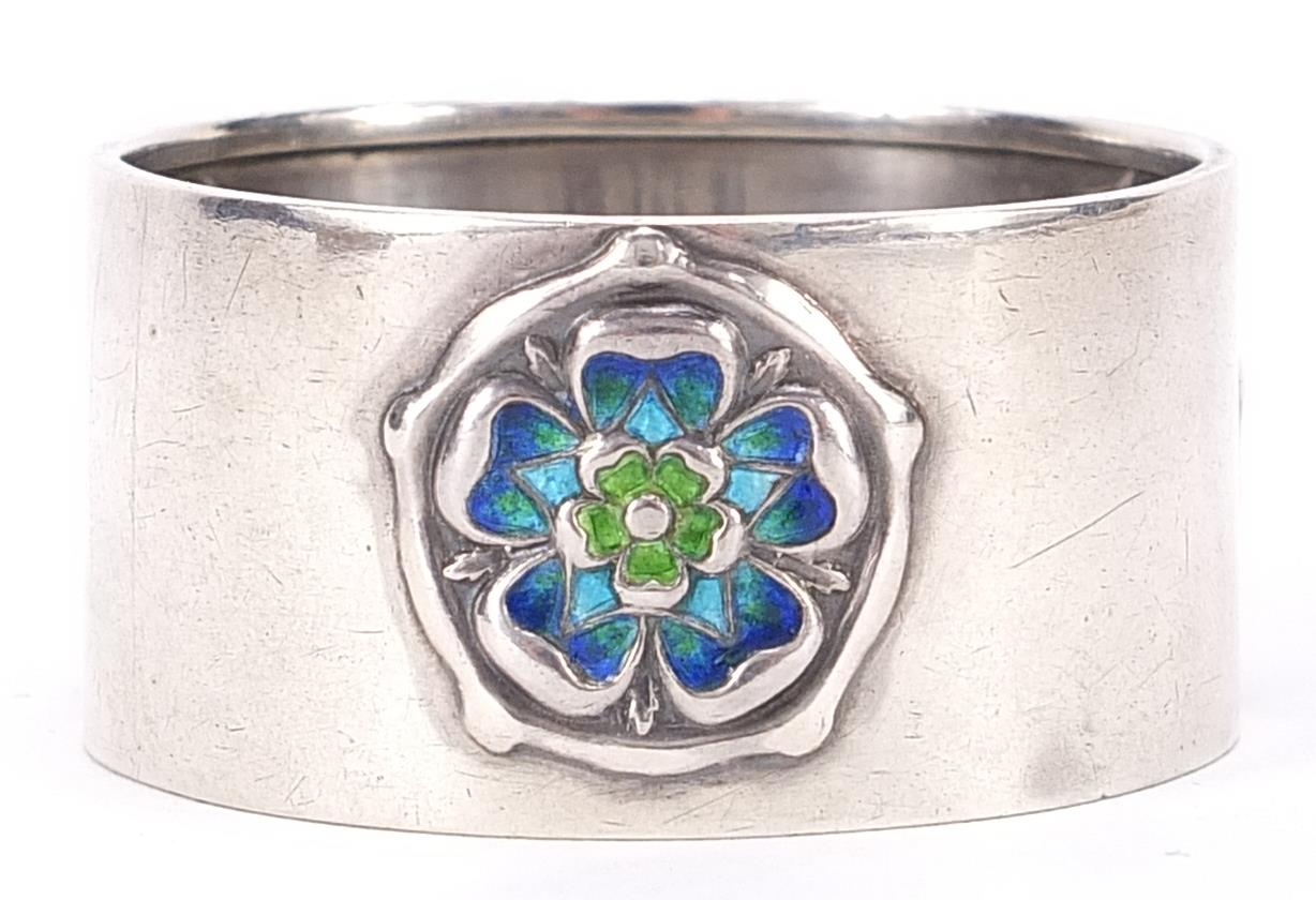 William Hair Haseler for Liberty, Art Nouveau circular silver and enamel napkin ring with stylised