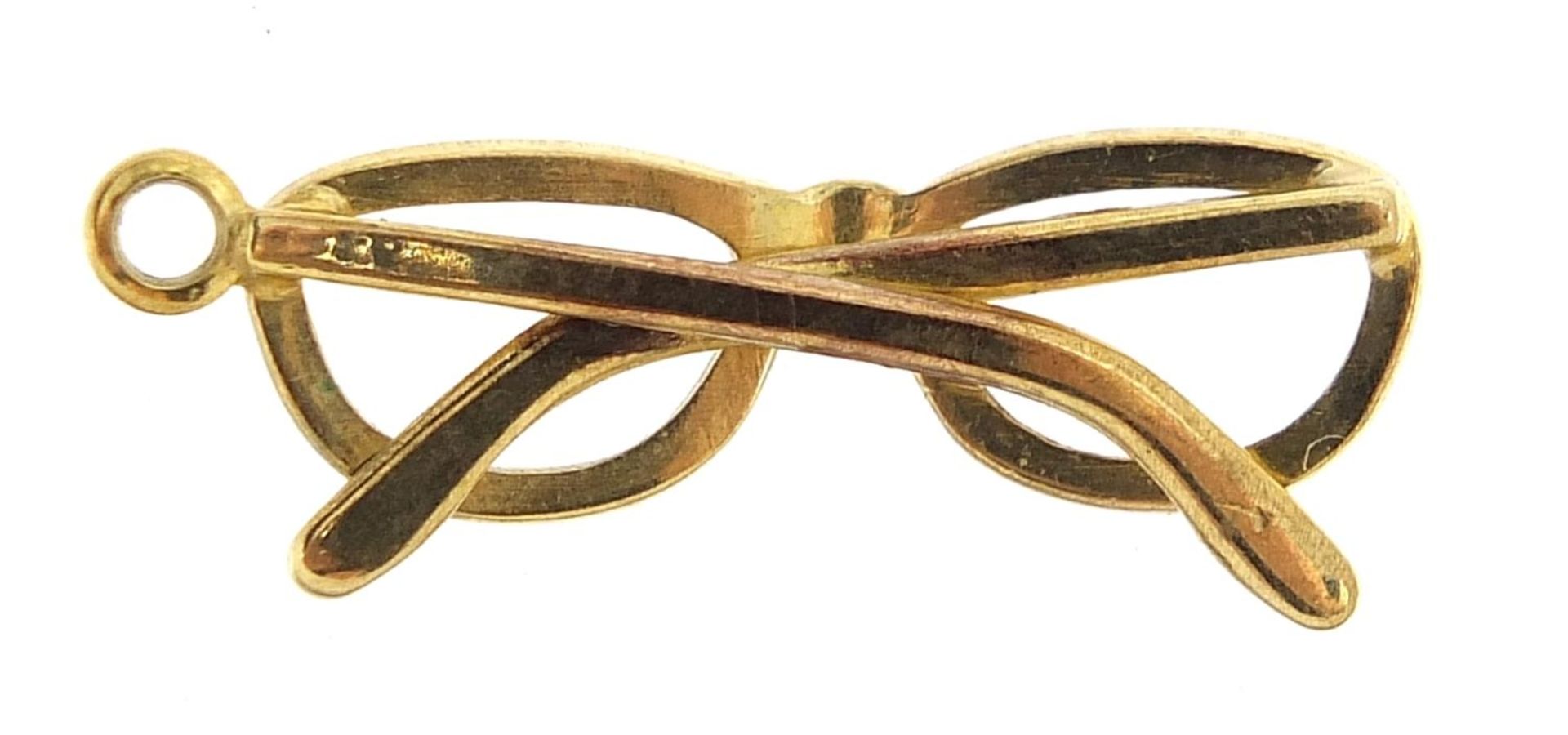 Unmarked gold pair of spectacles charm, (tests as 9ct gold) 2.2cm high, 1.3g - Image 2 of 2