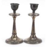 Pair of Arts & Crafts circular tapering silver candlesticks, indistinct maker's mark Birmingham