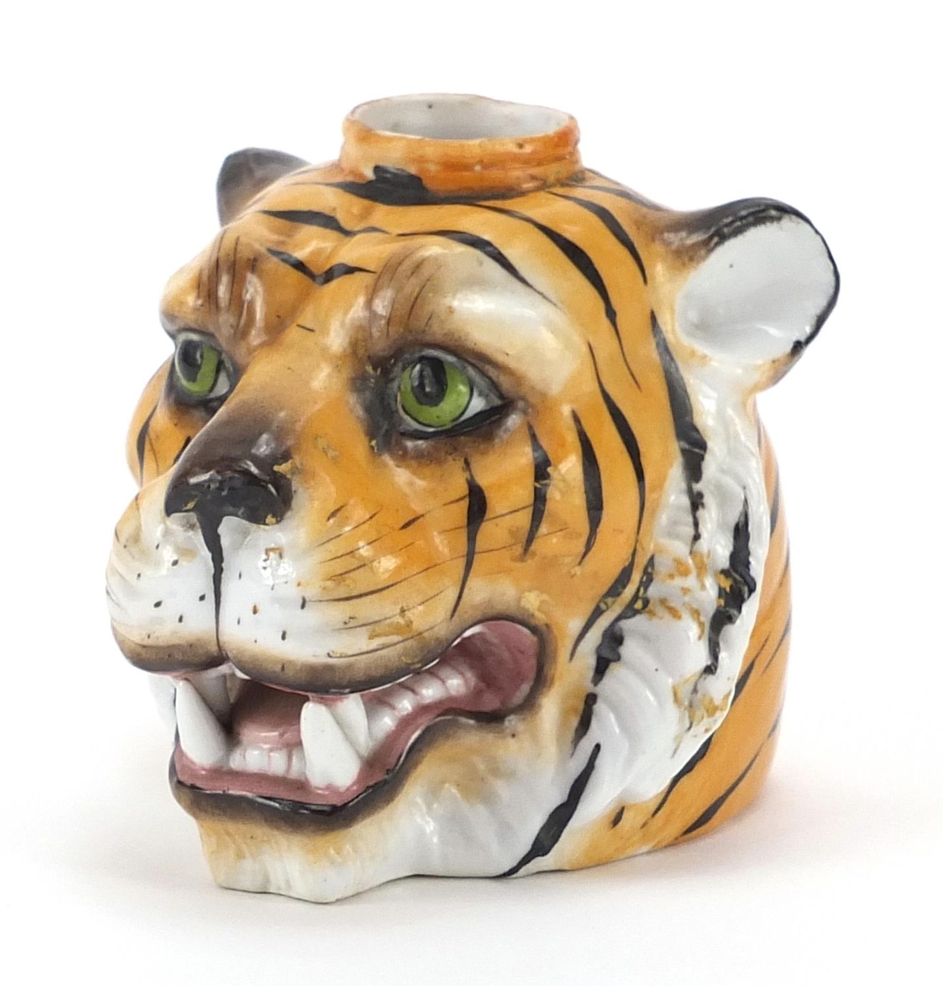 Continental porcelain inkwell in the form of a tiger's head, impressed marks to the base, 9cm in