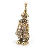 9ct gold articulated clown pendant set with pink and clear stones, 4.5cm high, 6.0g