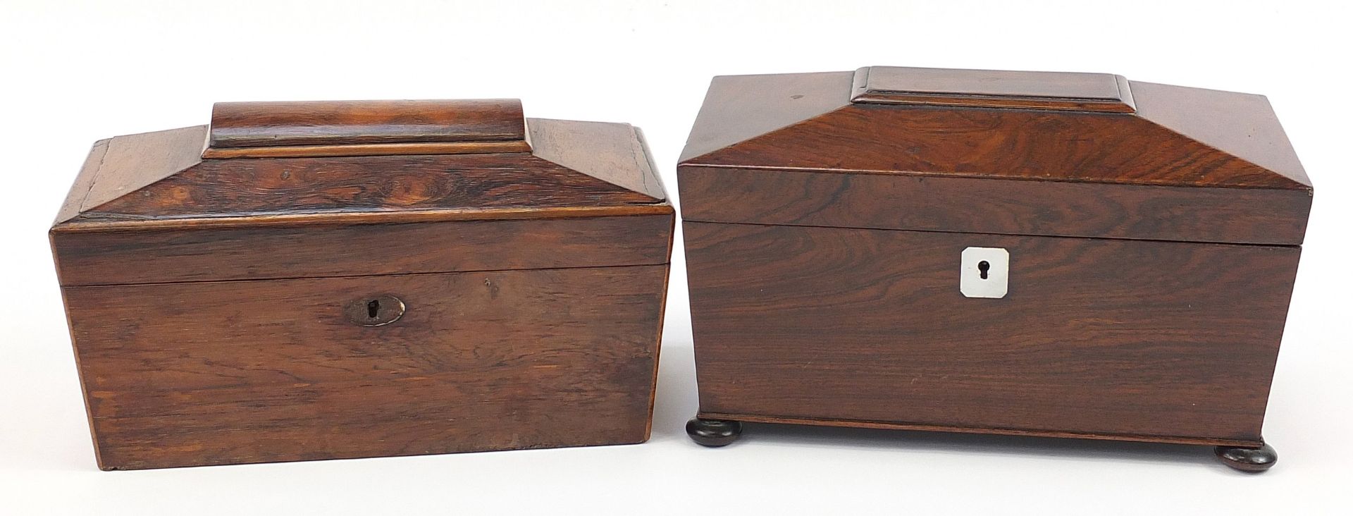 Two 19th century rosewood sarcophagus shaped tea caddies with twin divisional interiors, the largest