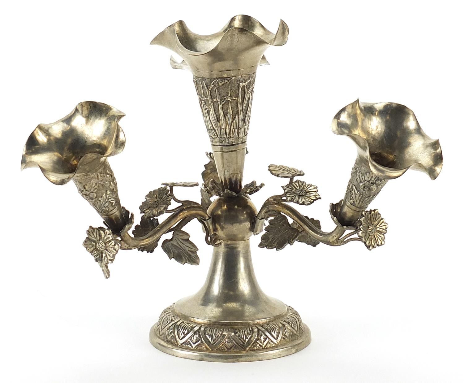 Anglo Indian white metal four branch epergne embossed with flowers, 17cm high 298.8g