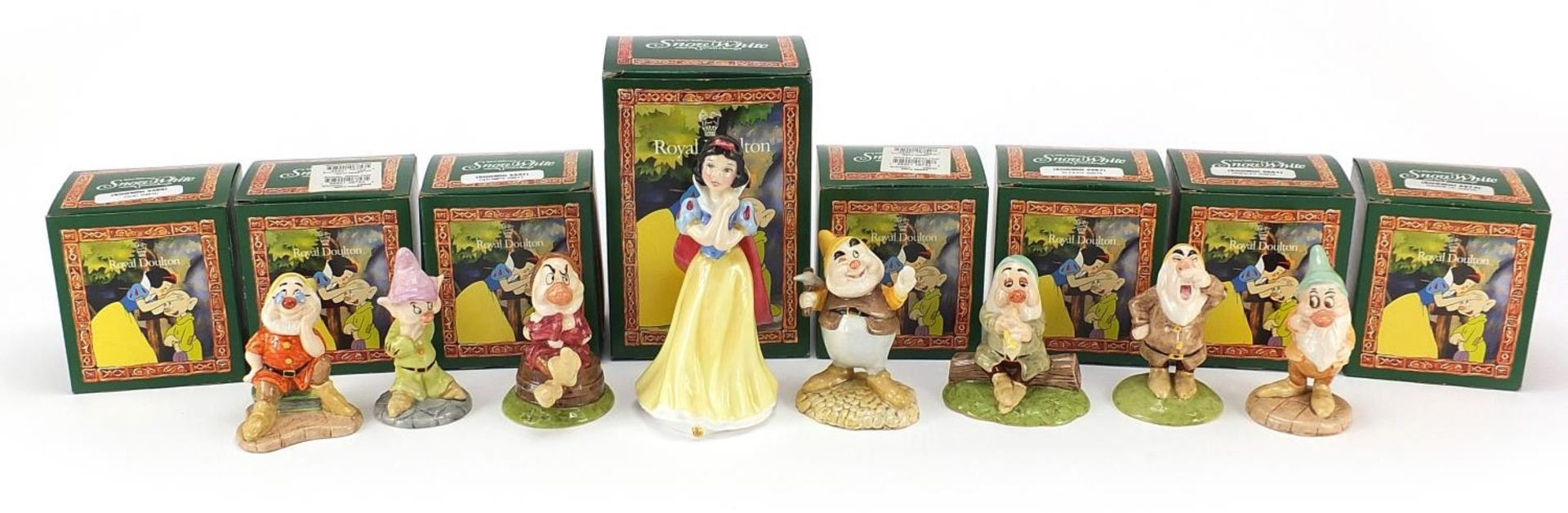 Royal Doulton Snow White & The Seven Dwarfs with boxes, the largest 15cm high