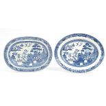 Pair of Wedgwood blue and white Willow pattern meat plates, the largest 32cm wide