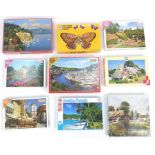 Assorted one thousand plus piece jigsaw puzzles, some unopened, including Heritage Jumbo tropical