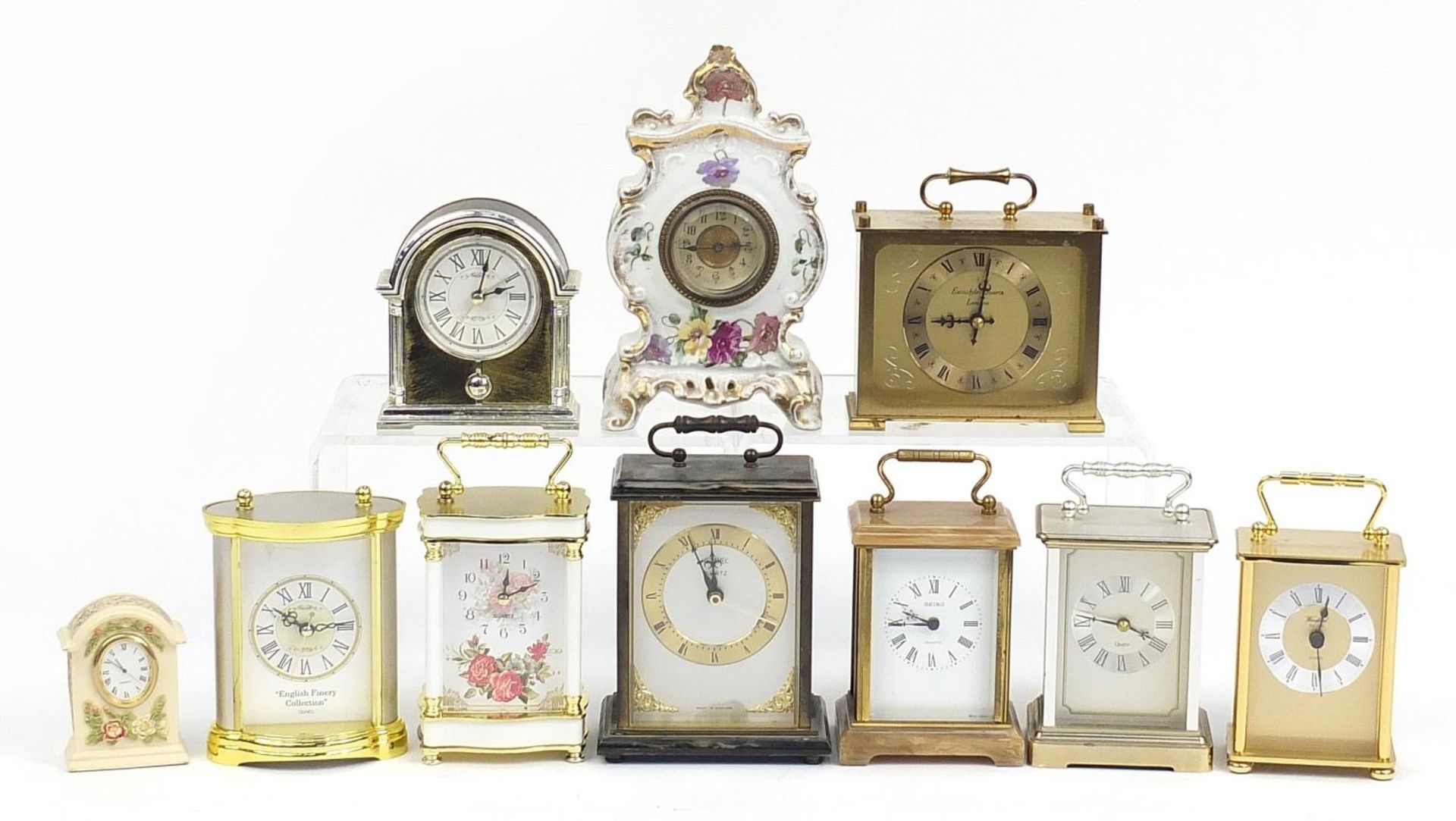 Selection of mantle clocks including a ceramic floral example, Seiko quartz and alabaster the
