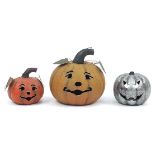 Three metal garden pumpkin lanterns, the largest 37cm high