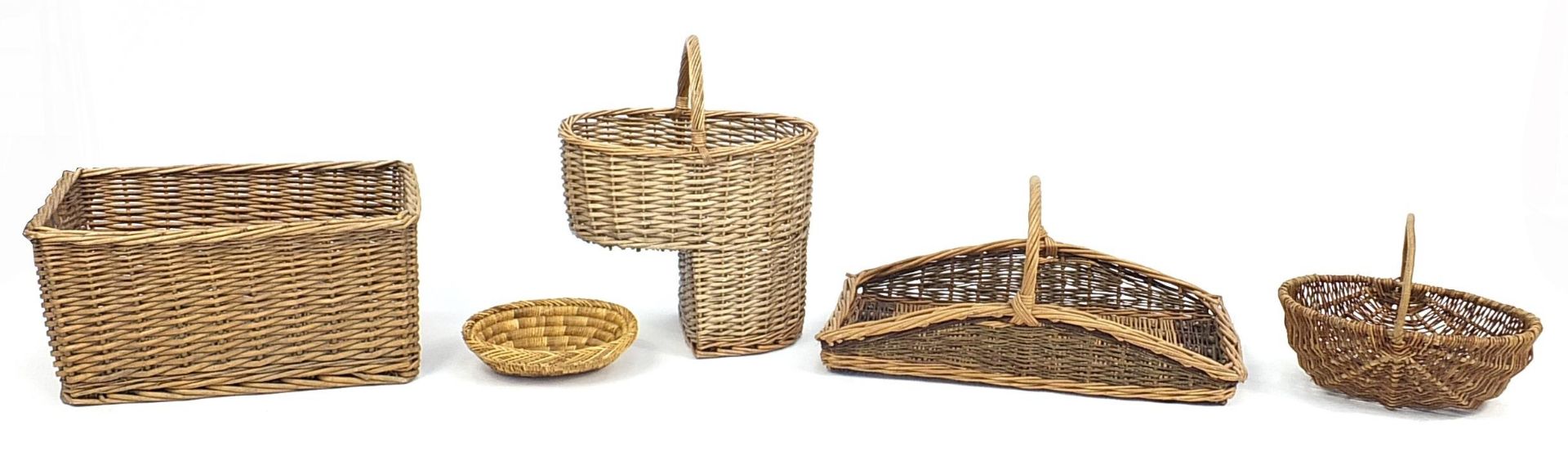 Wicker step basket, trug style basket, deep basket and two others, the largest 26cm H x 48cm W x