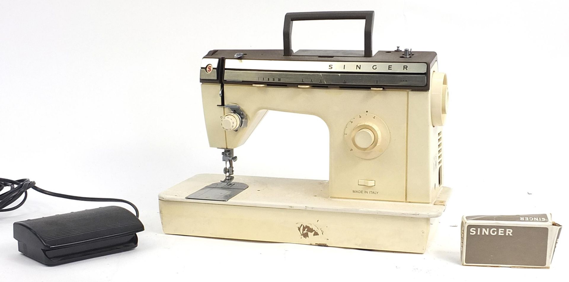 Cased Singer electric sewing machine