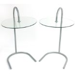 Pair of silver metal stylish circular glass side tables, each 72cm