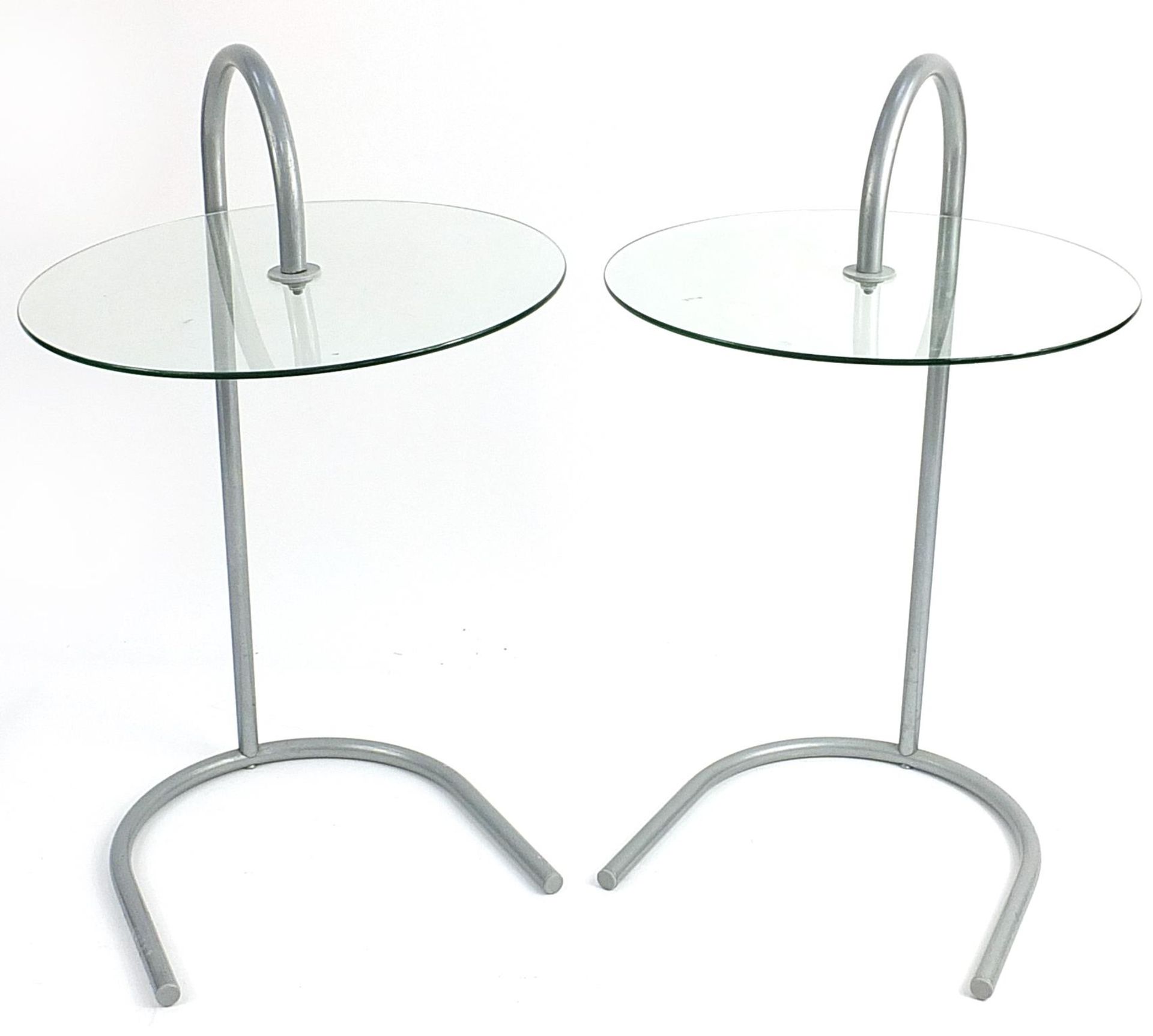 Pair of silver metal stylish circular glass side tables, each 72cm