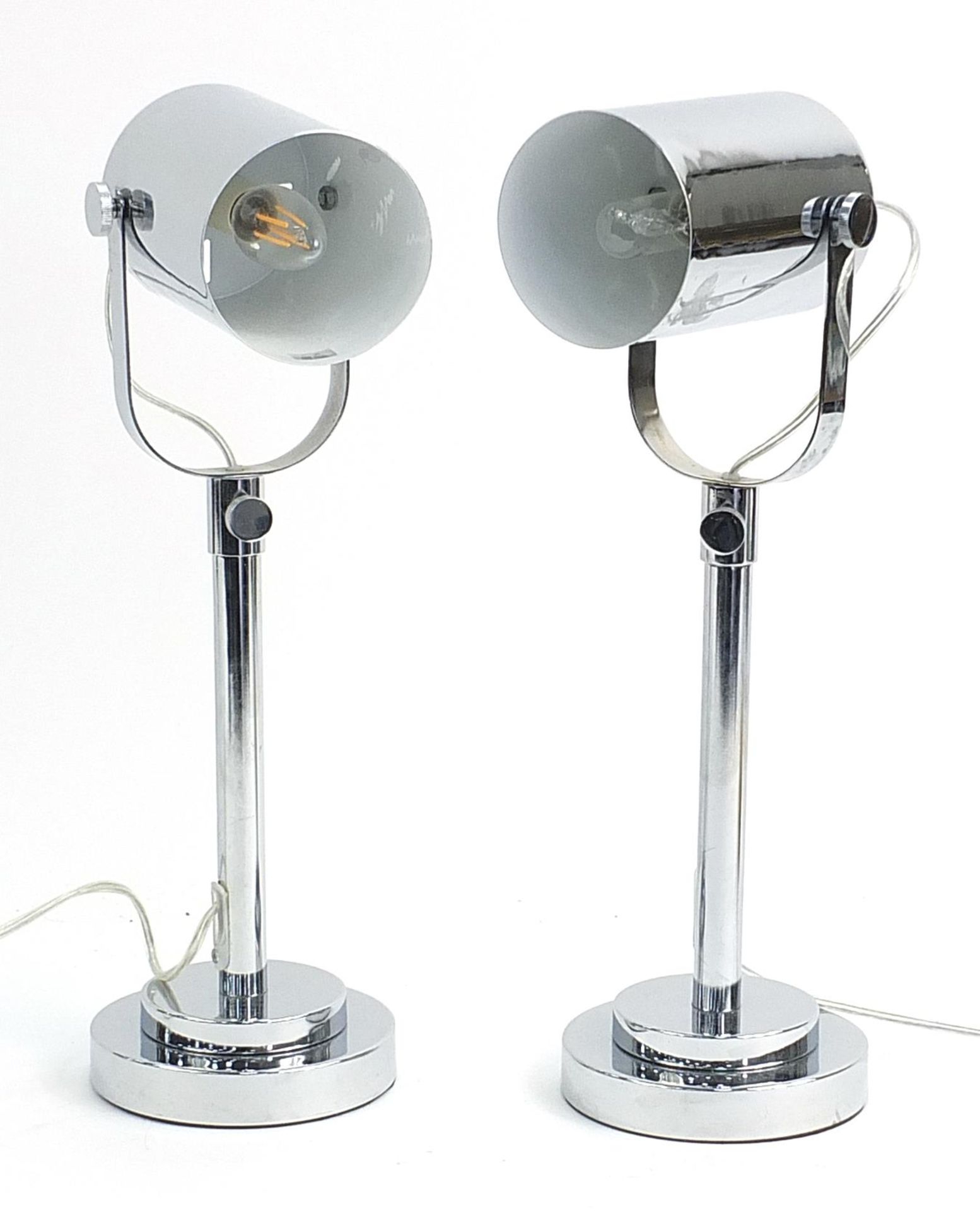 Pair of polished chrome theatre style table lamps, each 49cm high