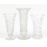 Three cut glass vases, the largest 26cm high