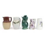 Ceramic jugs including Wedgwood fish jug, violet design jug and studio pottery jug, the largest 22cm