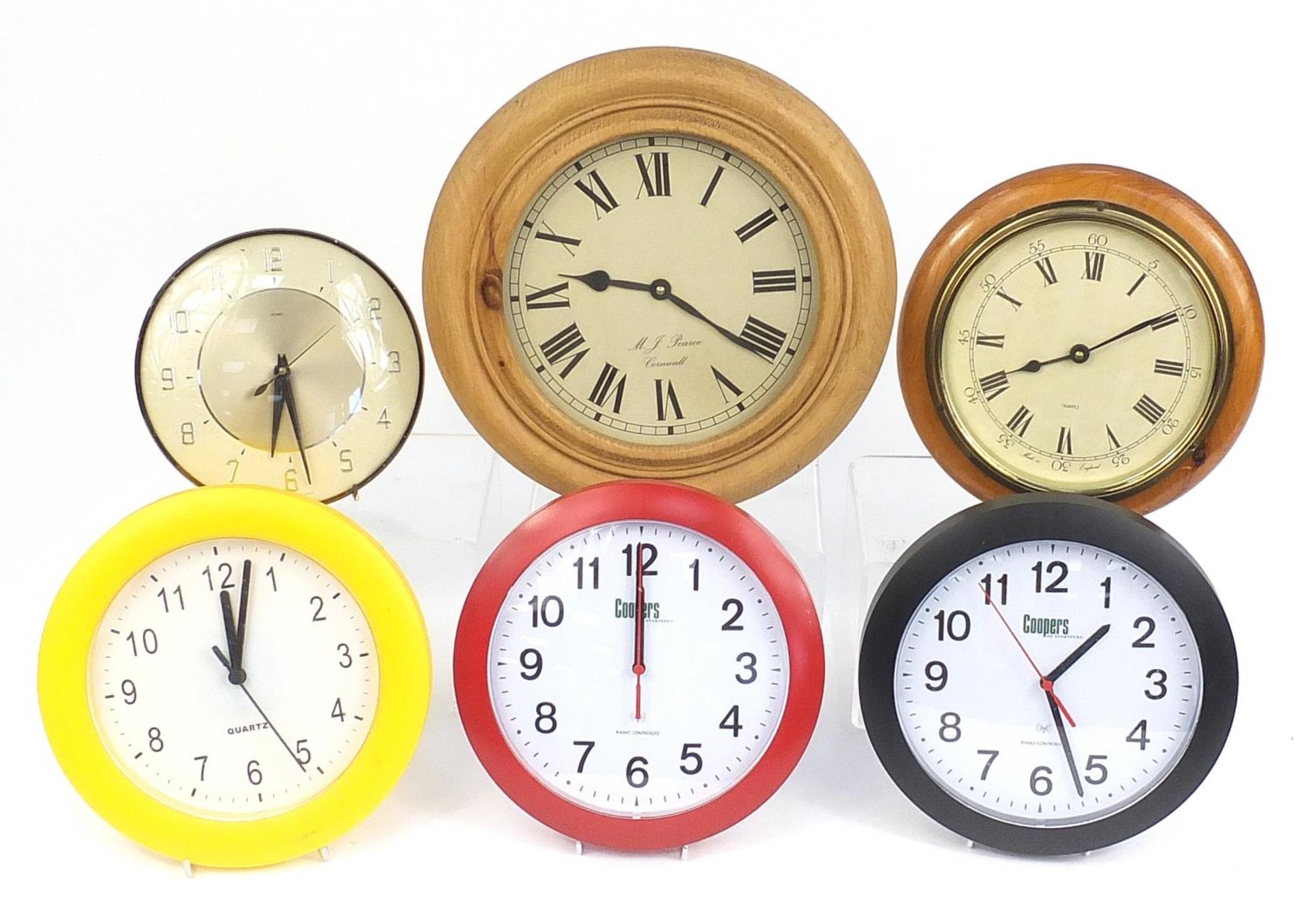 Selection of wall clocks including a retro Metamec example, the largest 33cm round